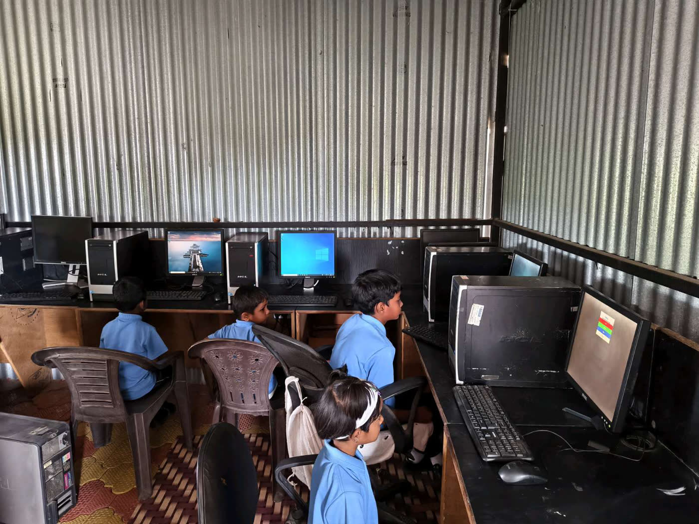 Students at desktop computers in the computer room